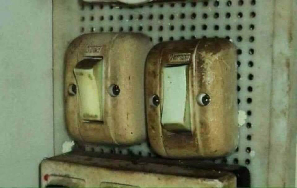 two faces in two light switches