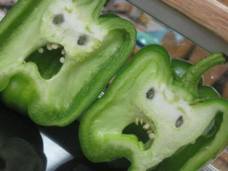 two faces in two bell peppers